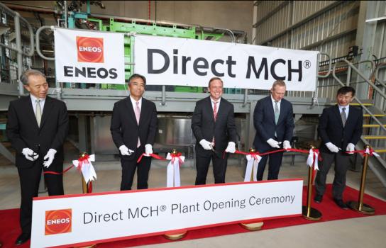 Five men in suits cutting a ribbon at the opening of ENEOS’ green hydrogen demonstration facility.